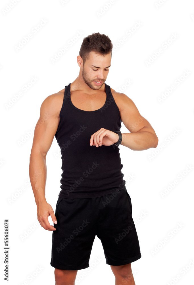Handsome sportsman looking at his watch Handsome sportsman looking at his watch
