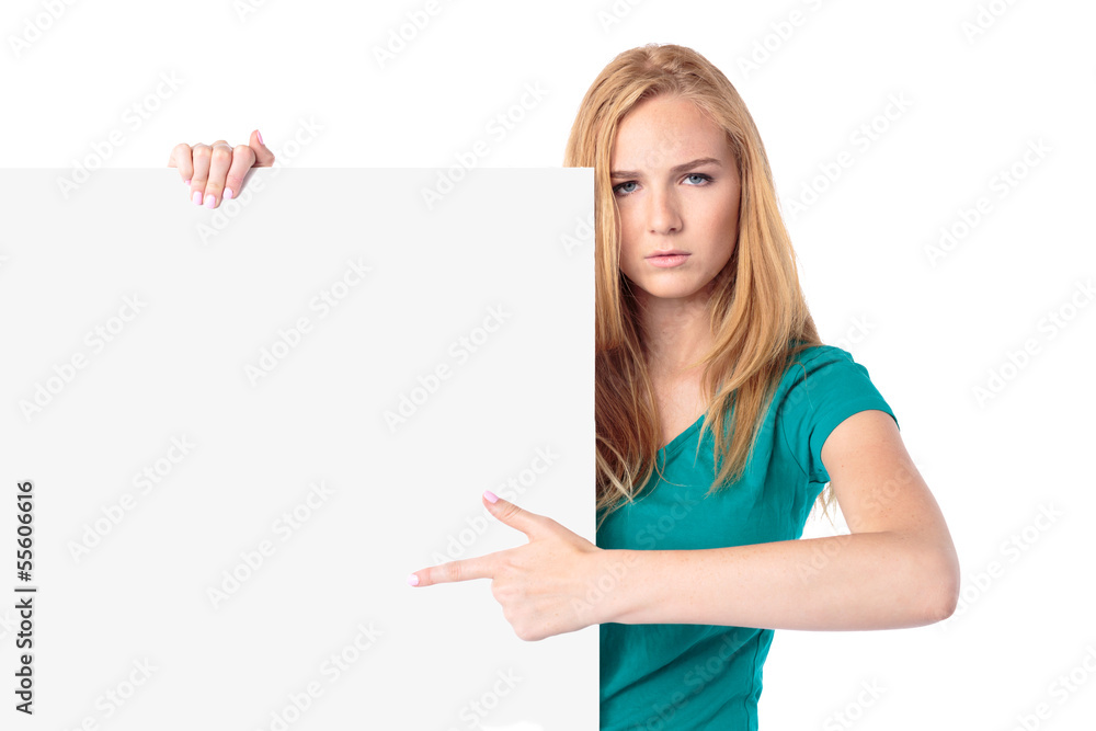 Serious woman pointing to a blank sign Serious woman pointing to a blank sign