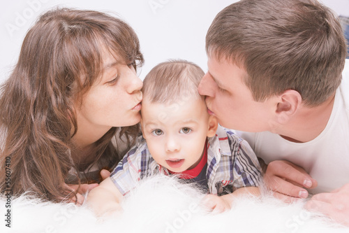 Portrait of Caucasian family with little son together on floor k photo