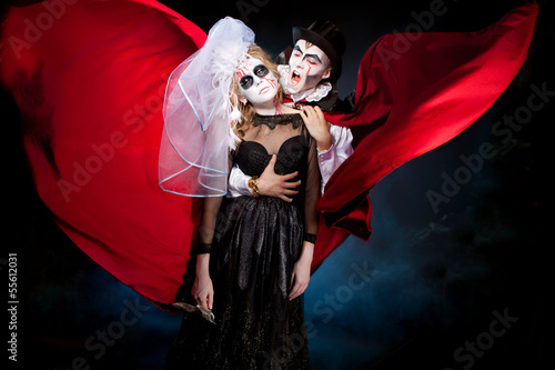 man and woman  wearing  as  vampire and dead bride. Halloween photo