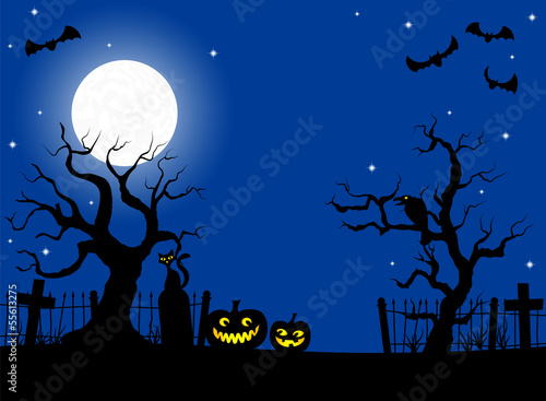 pumpkins in a full moon night at cemetery