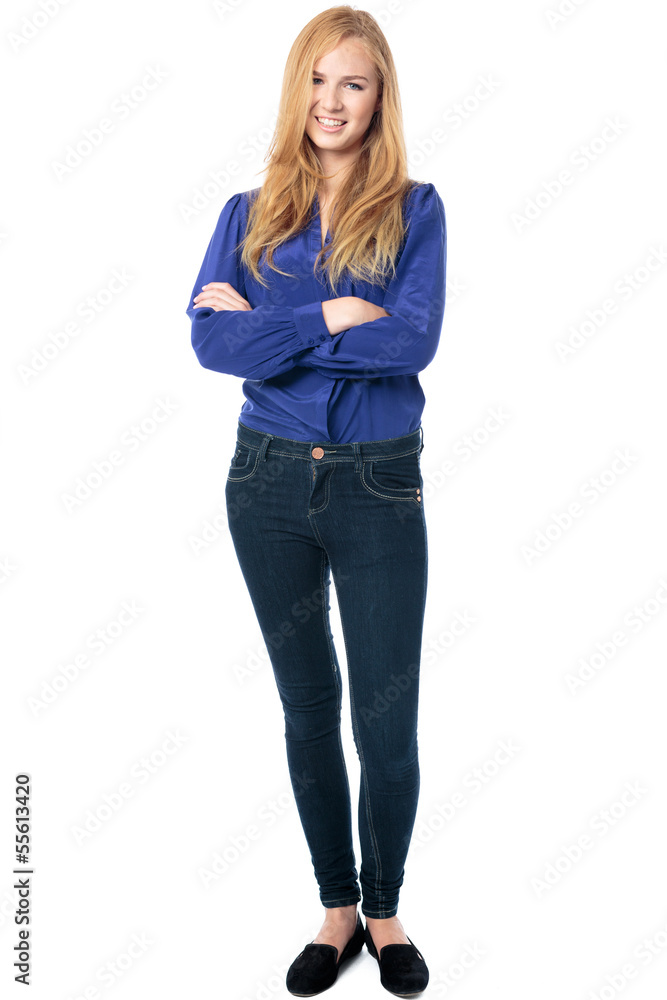 Trendy woman standing with folded arms Trendy woman standing with folded arms