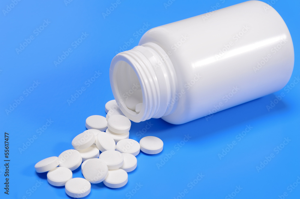 Capsules spilling from a medicine bottle Capsules spilling from a medicine bottle