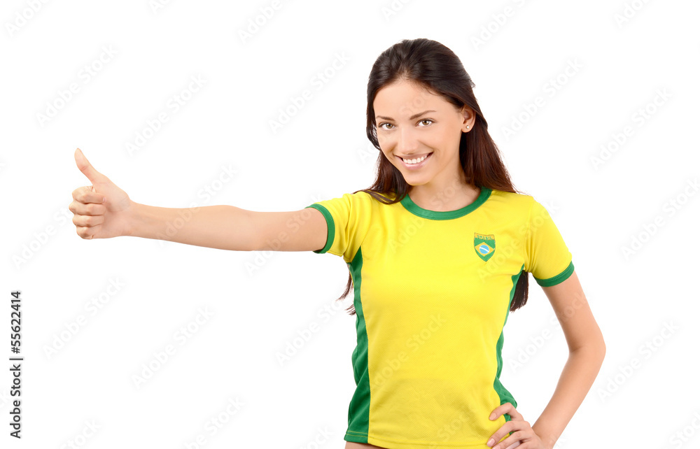 Thumbs up for Brazil.Girl with Brazilian flag on her t-shirt. Thumbs up for Brazil.Girl with Brazilian flag on her t-shirt.
