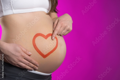 Wallpaper Mural Pregnancy. Side view of pregnant woman touching her abdomen whil Torontodigital.ca