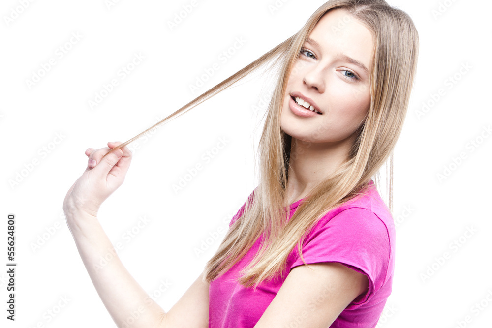 young beautiful woman touches her hair young beautiful woman touches her hair