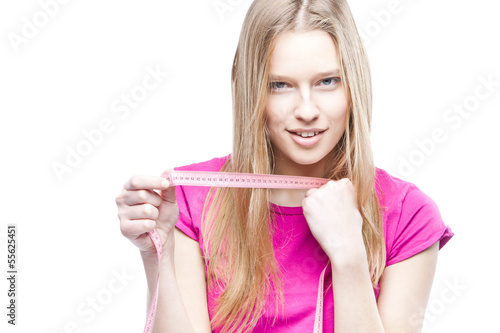 Close-up of a young beautiful woman holding meter