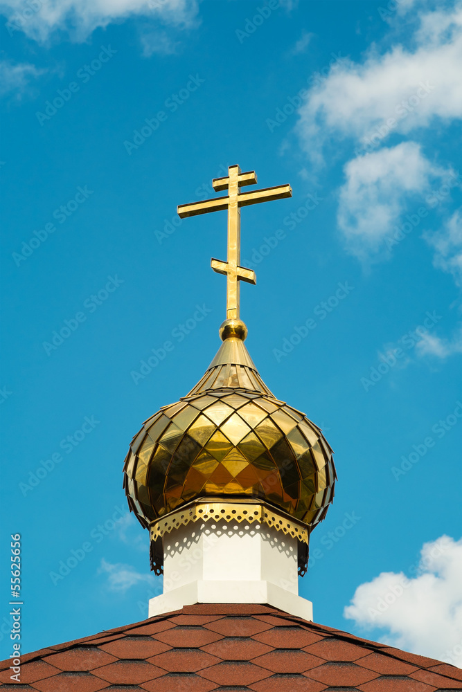 Church cross on the sky background (closeup)