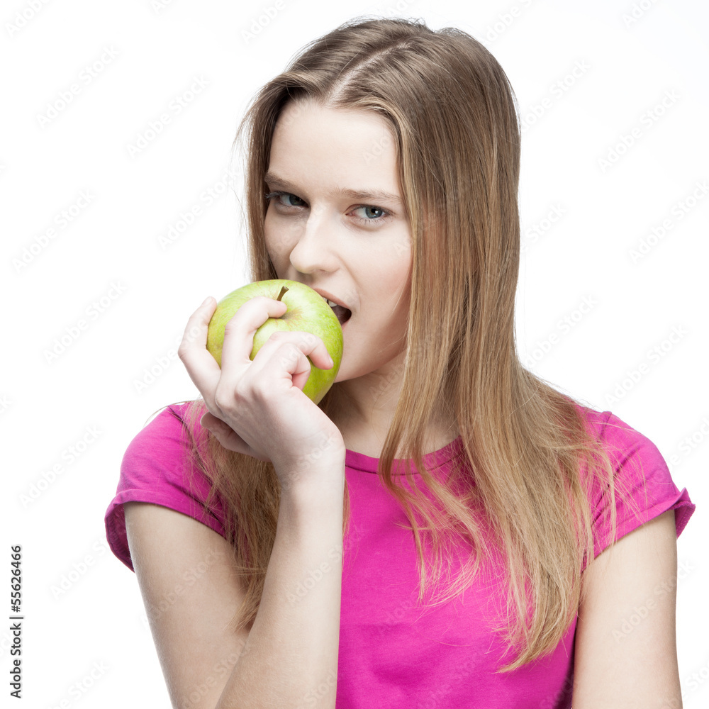 young beautiful blond woman eating green apple