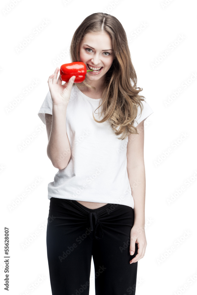 young beautiful brunette woman holding red pepper