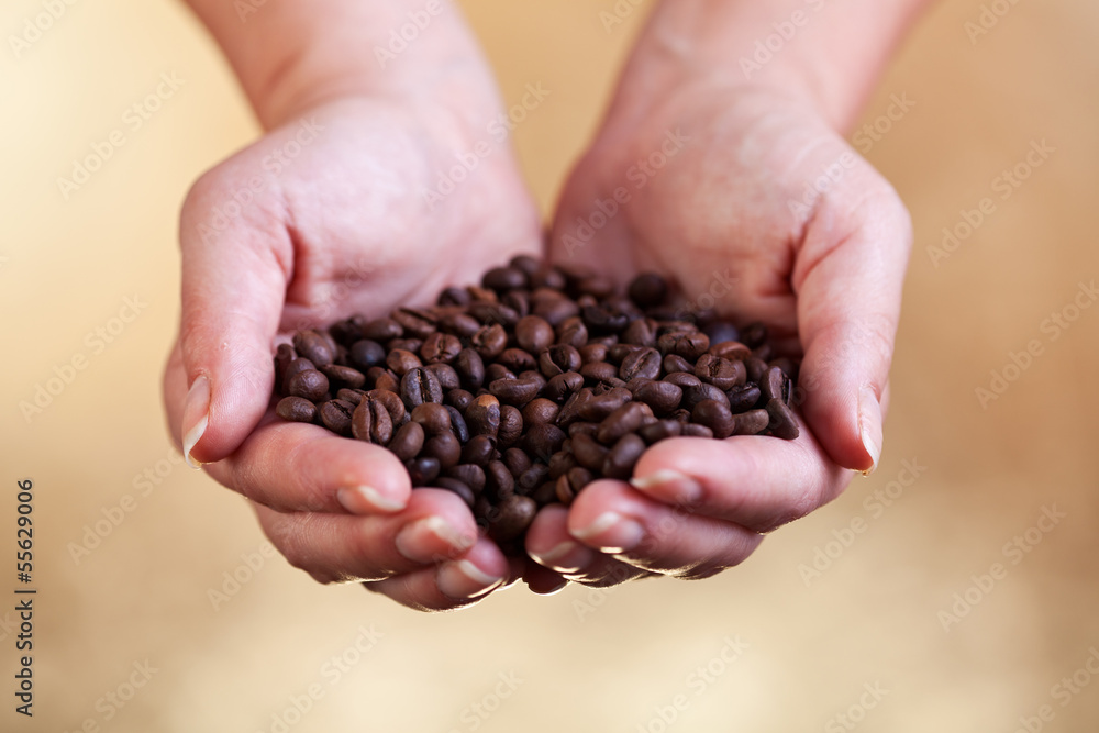 Handful of fresh roasted coffee Handful of fresh roasted coffee