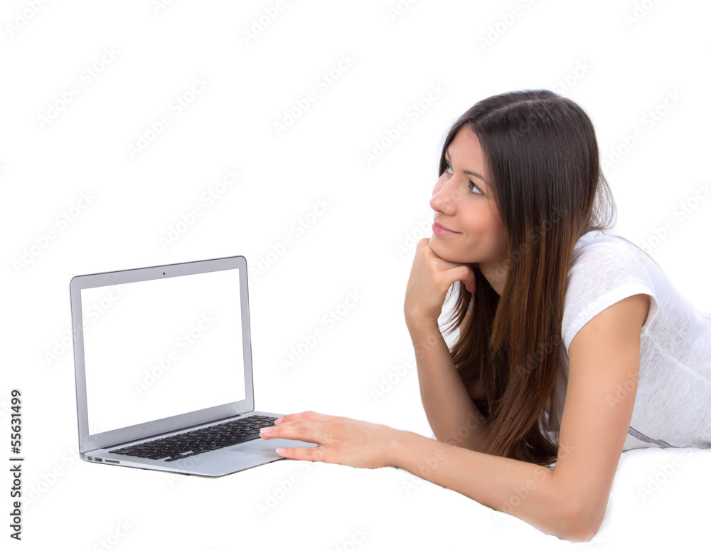 Young woman lying on bed with laptop computer Young woman lying on bed with laptop computer