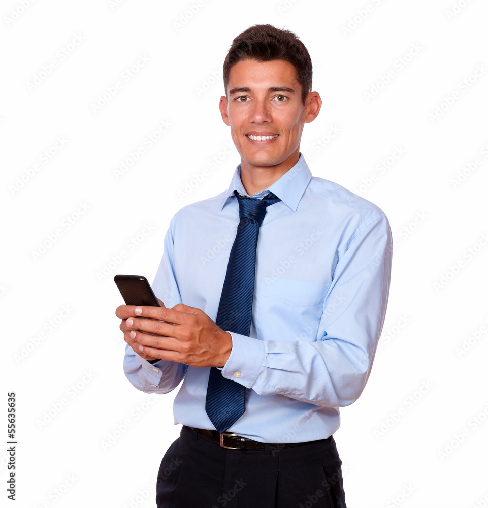 Young male businessman texting on his cellphone Young male businessman texting on his cellphone