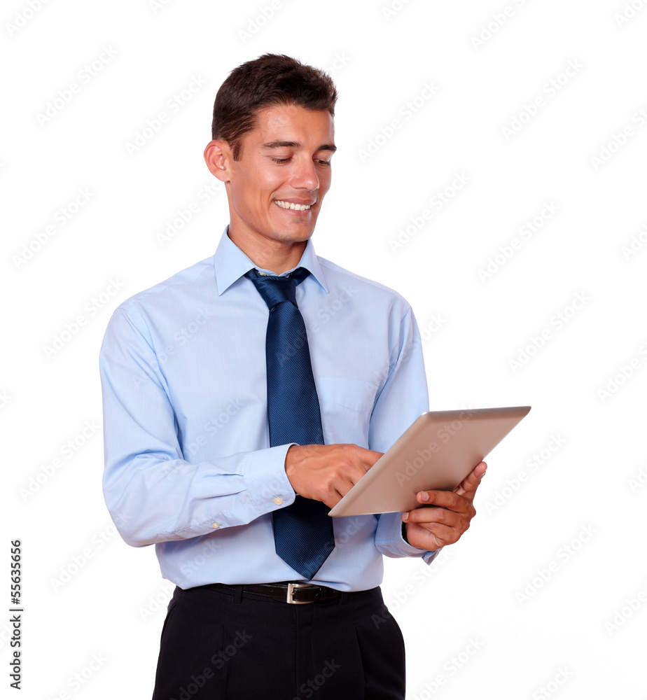 Hispanic young man in tie using tablet pc Hispanic young man in tie using tablet pc