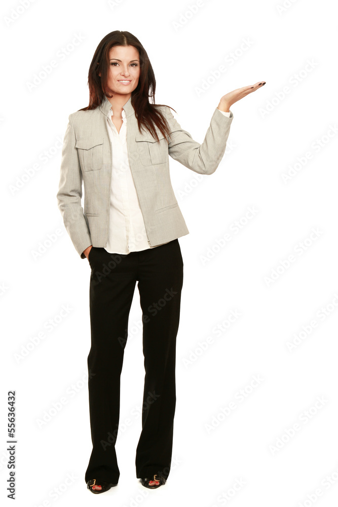 Portrait of a smiling young woman pointing up Portrait of a smiling young woman pointing up