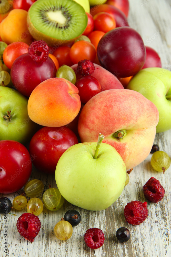 Assortment of juicy fruits, on wooden background Assortment of juicy fruits, on wooden background