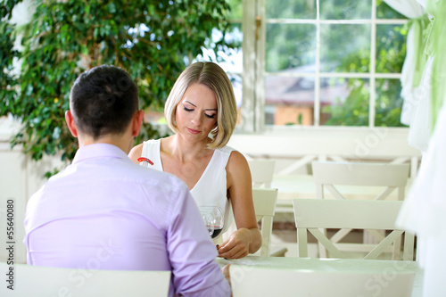 Beautiful couple having romantic dinner at restaurant