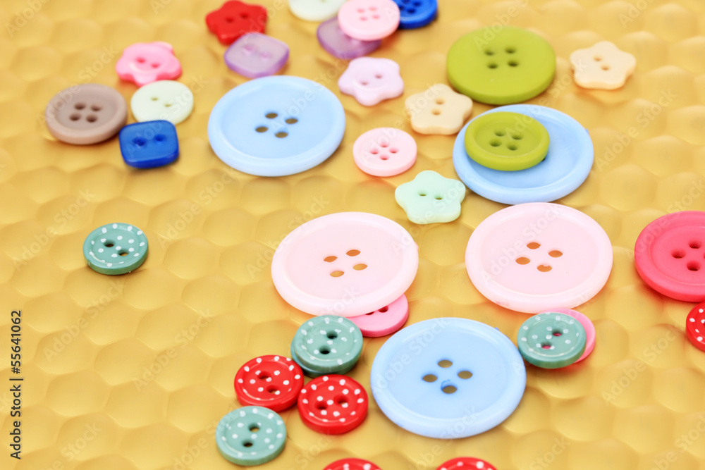 Color buttons on bright background, close-up Color buttons on bright background, close-up