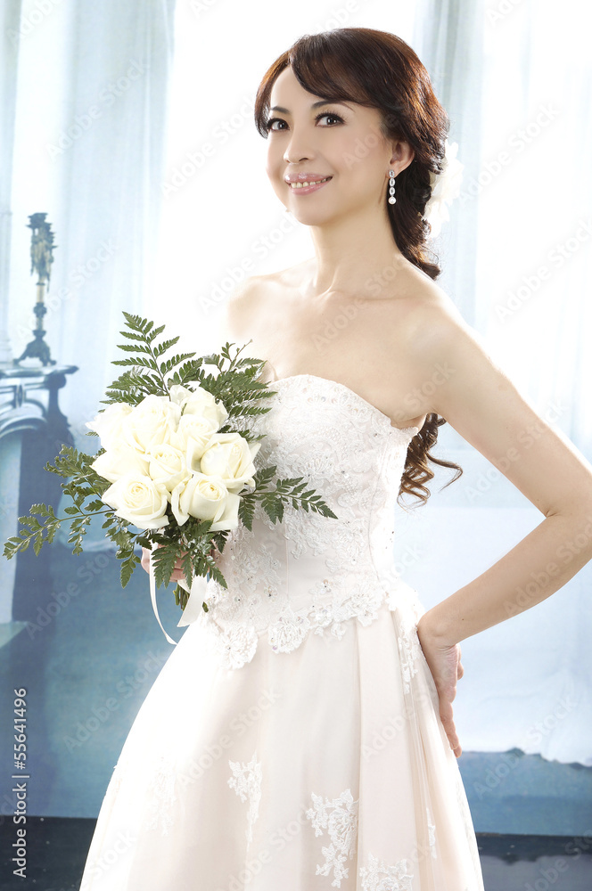 beautiful bridge in dress holding bouquet in her hands, beautiful bridge in dress holding bouquet in her hands,