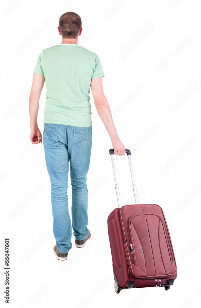 back view of walking man with suitcase. back view of walking man with suitcase.
