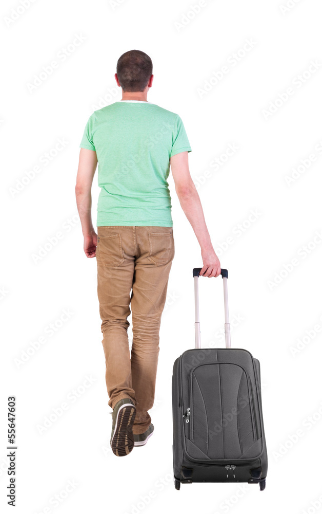 back view of walking man with suitcase. back view of walking man with suitcase.