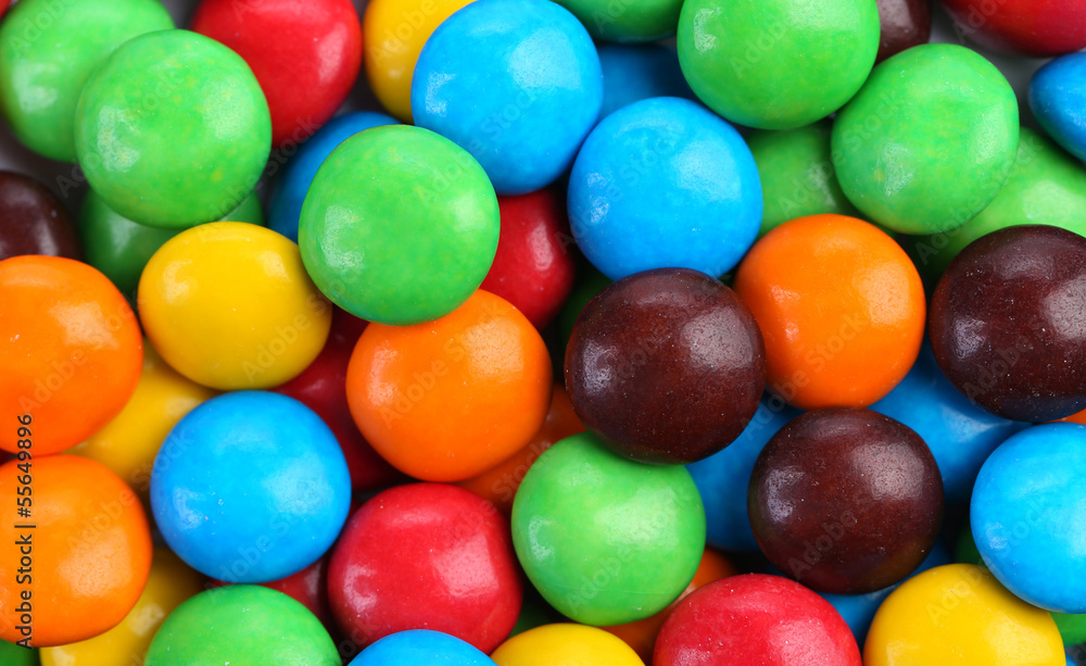 Chocolate drops with bright color candy coating. Chocolate drops with bright color candy coating.