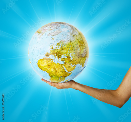 Earth globus in hand globe earth