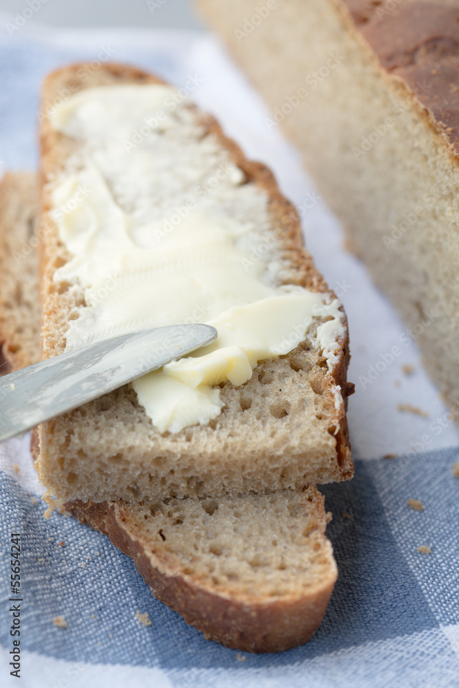 Slices of wholemeal bread with butter Slices of wholemeal bread with butter