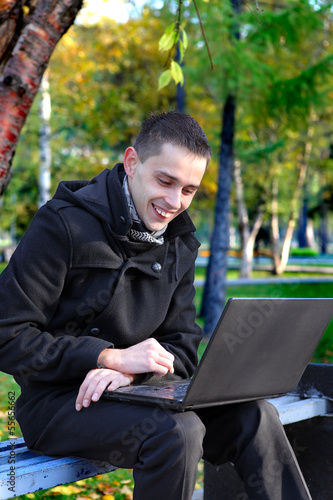 Happy Man with Laptop Outdoor
