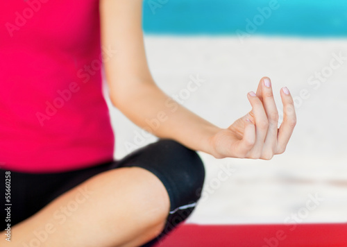 girl sitting in lotus position and meditating