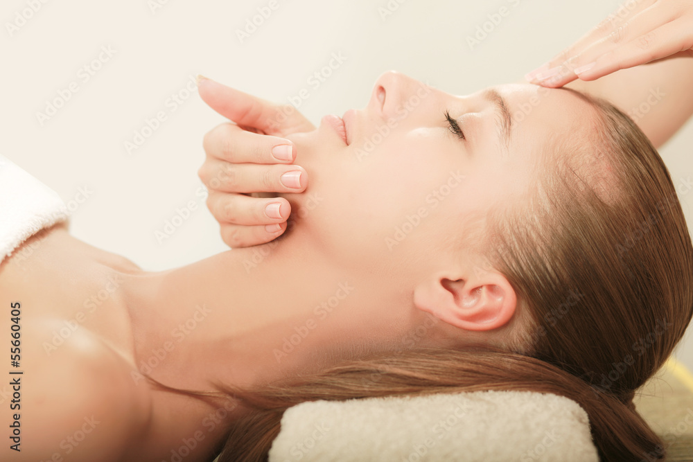 An attractive young woman receiving massage An attractive young woman receiving massage