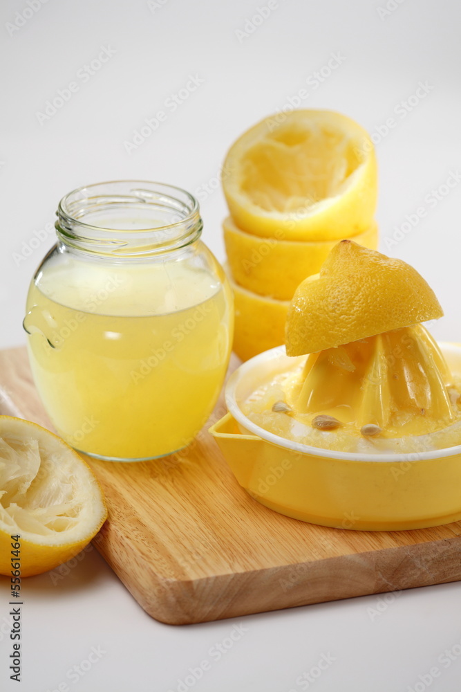 Squeezing lemons with citrus squeezer