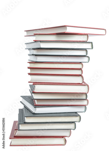 Stack of real books on white background
