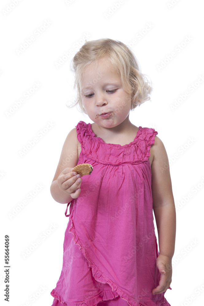 little girl in pink eating a biscuit, isolated on white little girl in pink eating a biscuit, isolated on white
