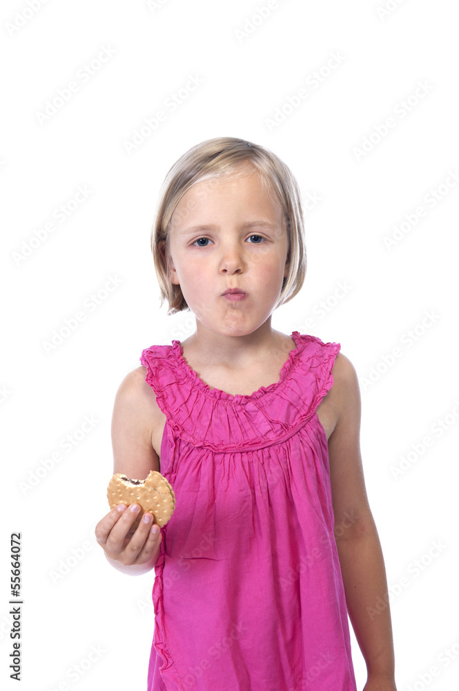 little girl in pink eating a biscuit, isolated on white little girl in pink eating a biscuit, isolated on white