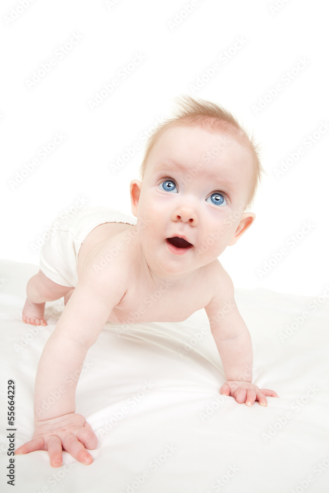 Baby on the white bed