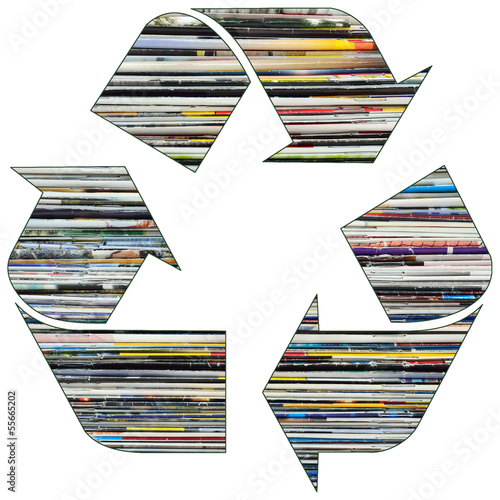 Recycle symbol with old magazines