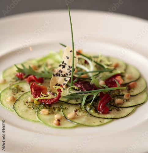 Zuccini carpaccio with dried tomatoes photo