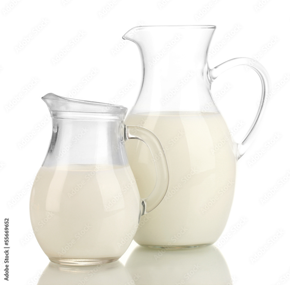 Milk in jugs isolated on white Milk in jugs isolated on white