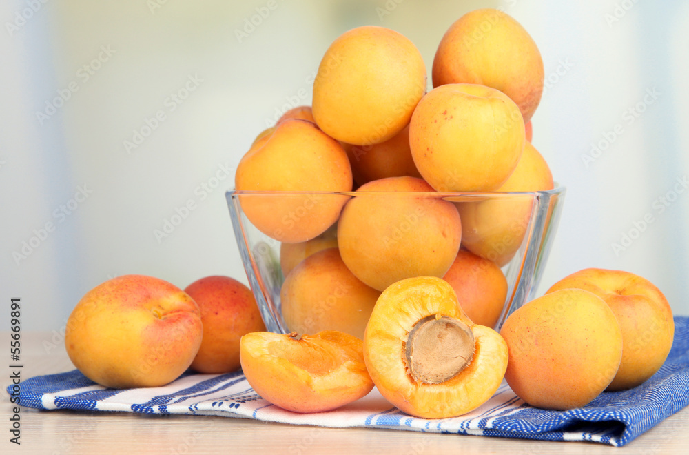 Fresh natural apricot in bowl on table in kitchen Fresh natural apricot in bowl on table in kitchen