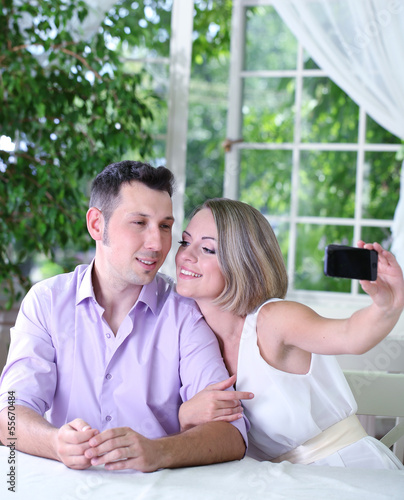 Young couple  taking  photo...
