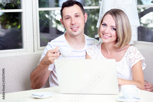 Young couple  with laptop, ...