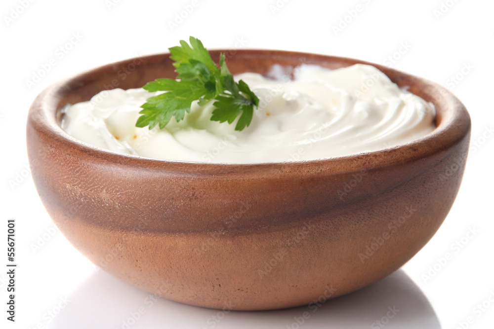 Sour cream in bowl isolated on white Sour cream in bowl isolated on white