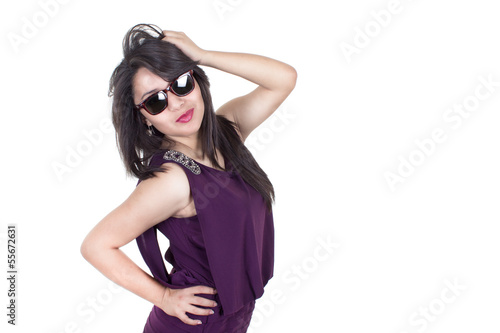 Pretty Hispanic woman wearing sunglasses