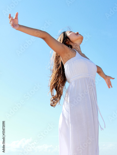 Woman with arms open enjoying her freedom