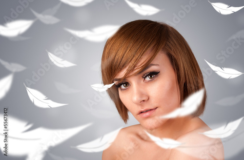Beautifull young girl with light feather skin concept