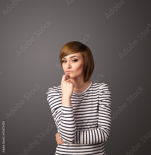 Young woman thinking with copy space