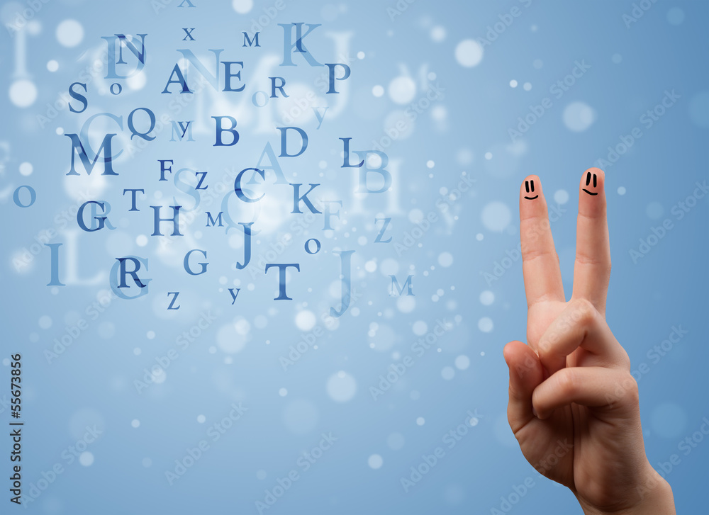 Happy smiley fingers looking at mixture of bokeh letters Happy smiley fingers looking at mixture of bokeh letters