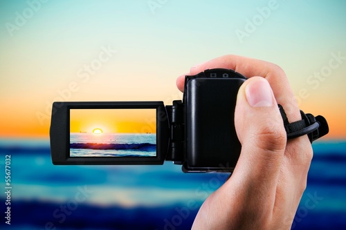Bild auf Leinwand Video camera or camcorder recording sunset
