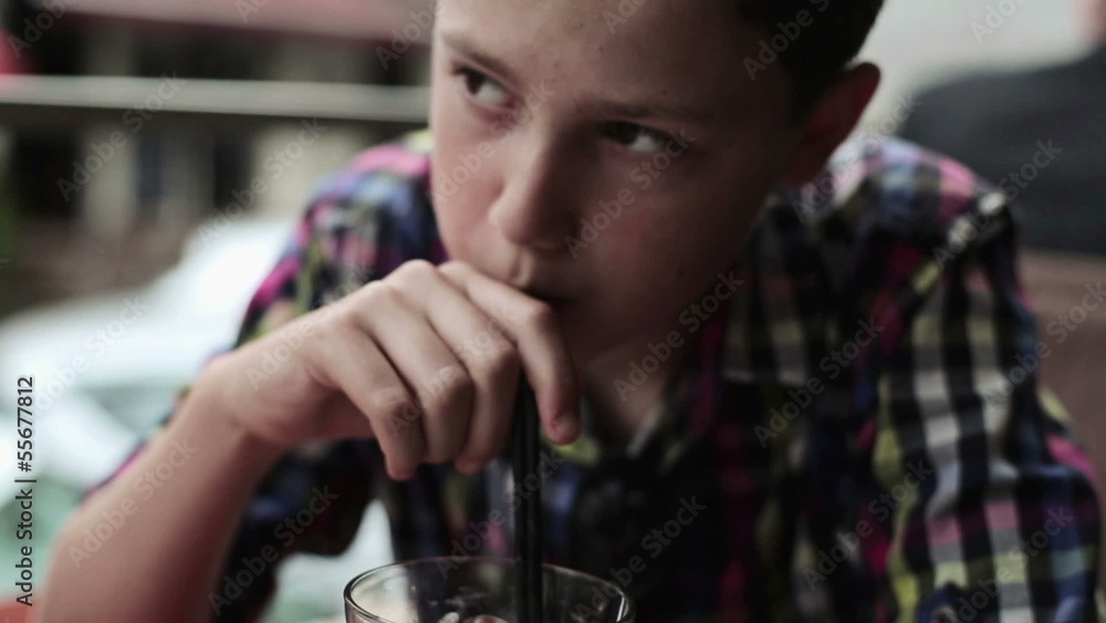 Young teenager drinking lemonade in cafe Young teenager drinking lemonade in cafe
